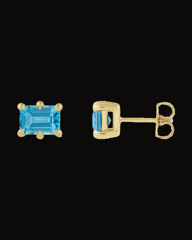 Natural Swiss Blue Topaz Stud Earrings — 14K Yellow Gold · 7 x 5 mm